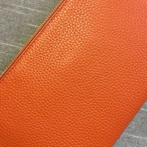 Michael Kors large zip burnt orange leather clutch